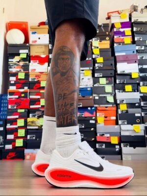 Nike ZoomX Running Shoes for Men - White with Black Swoosh and Red Sole | Tconcorde