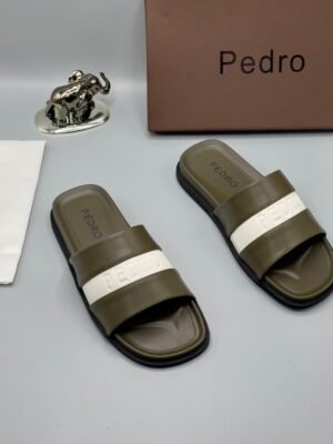 Premium Pedro slides with brown, navy blue, and white straps, presented with a brown box and accessories on a grey background, available at Tconcorde.